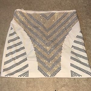 White party skirt with gold and black studs